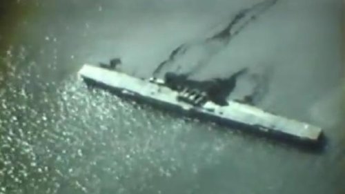 Aircraft Carrier U.S.S. Saratoga leaking oil, sinking at Bikini Atoll